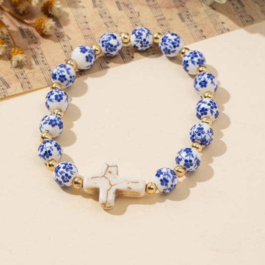 The Porcelain Cross Charm Stretch Bracelet