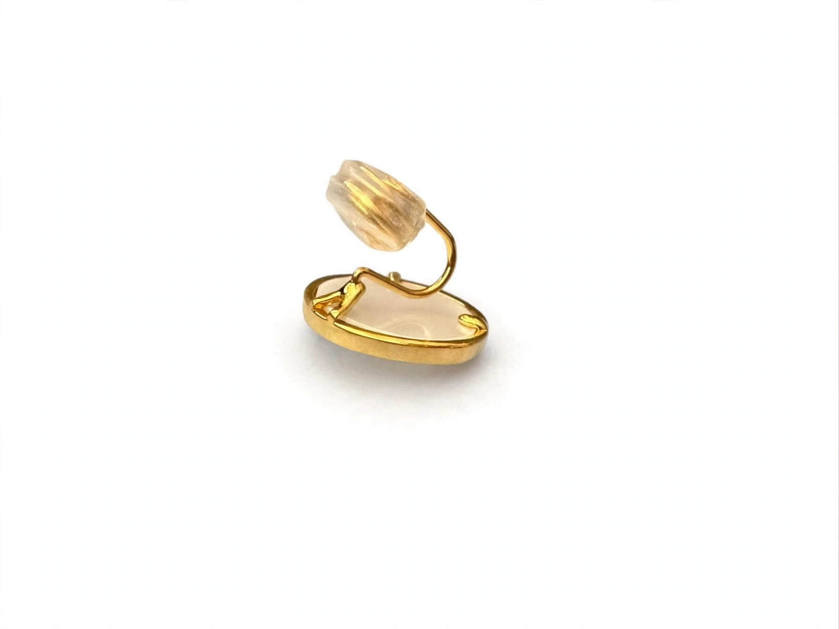 Side view of floral coin earring showing its clip-on closure