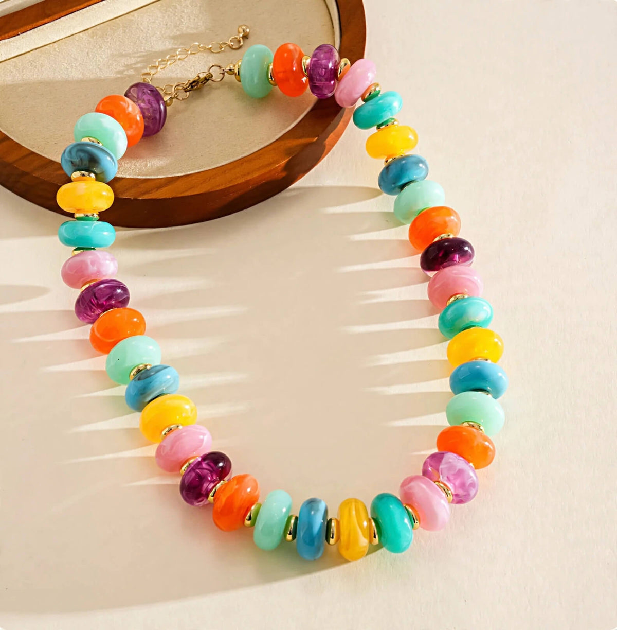 Multicolor rondelle bead necklace with gold-tone spacers