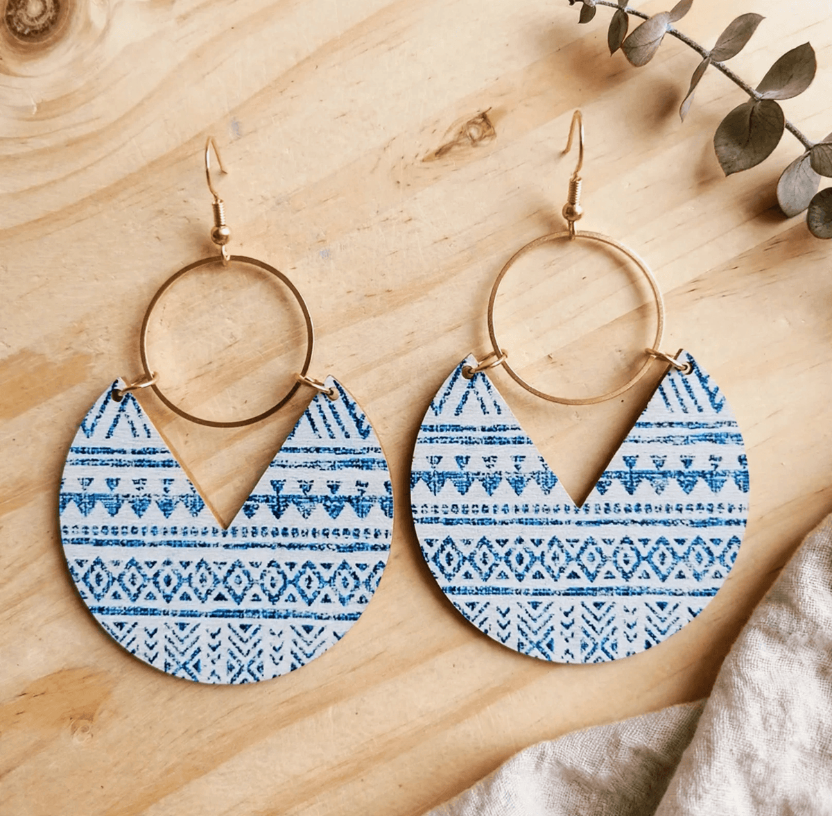 Blue-and-white geometric patterned wooden drop earrings with gold-tone rings