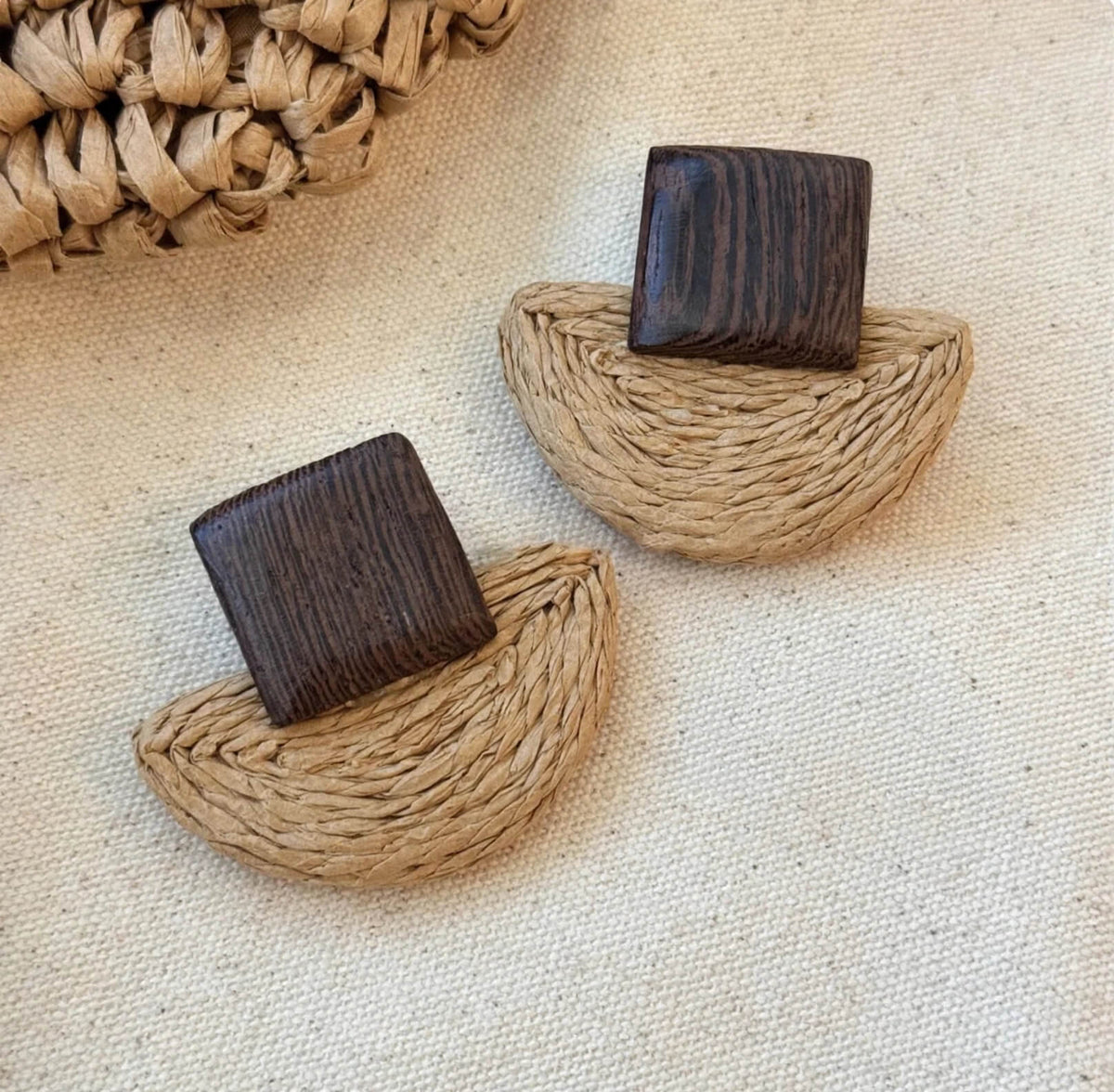 Tan layered woven fan earrings with dark brown square wood tops.
